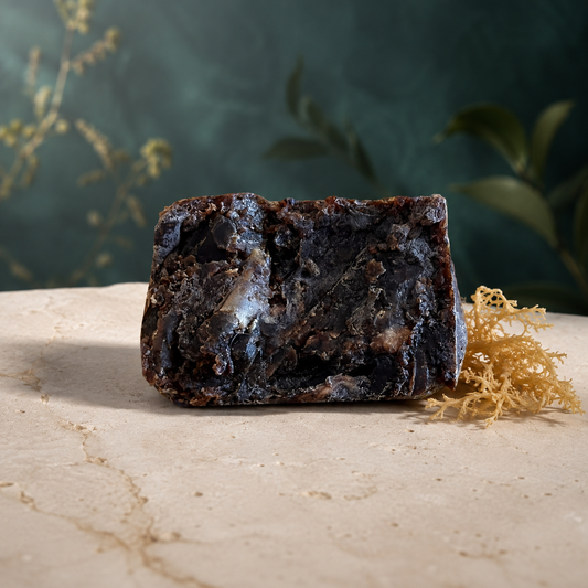 Handmade dark sea moss black soap bar with dried golden sea moss