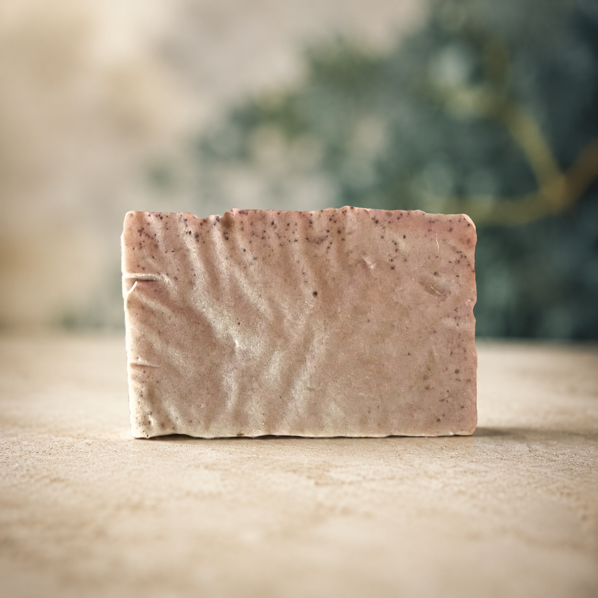 Actual handmade purple sea moss soap bar with enhanced cream and botanical background